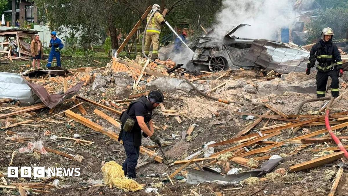 Emergency services clear through the rubble following a Russian missile strike just outside of Kyiv. Firefighters can be