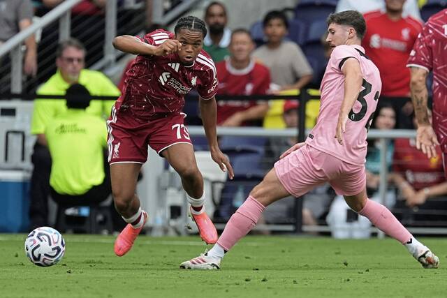 Liverpool FC forward Rio Ngumoha (73) battles for the ball with Sunderland AFC defender Trai Hume (32) during the first half