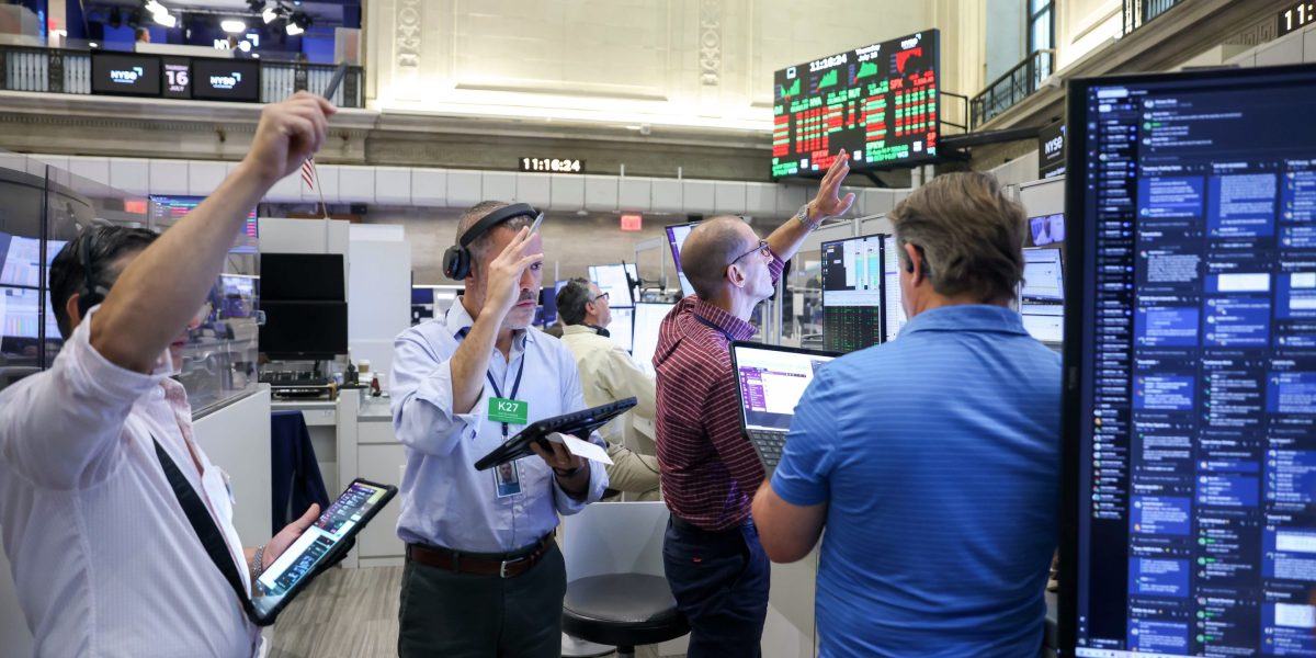 Traders work on the floor of the American Stock Exchange (AMEX) at the New York Stock Exchange (NYSE) on Thursday, July 16