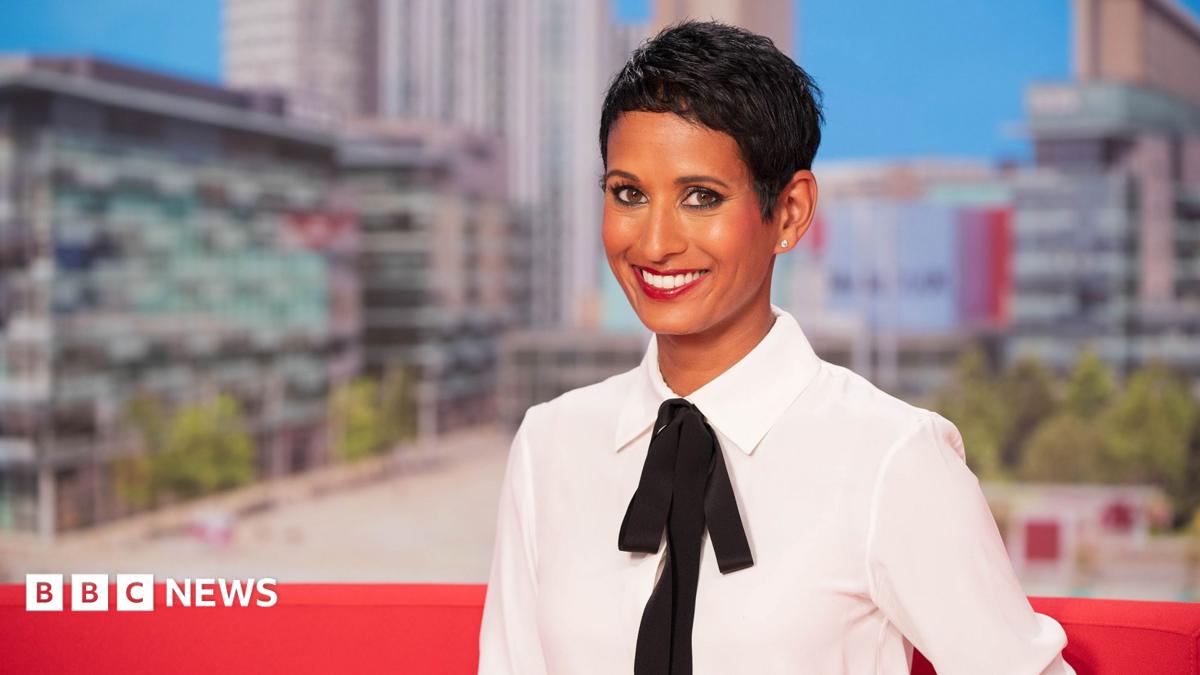 Naga Munchetty posing and smiling in the BBC Breakfast studio