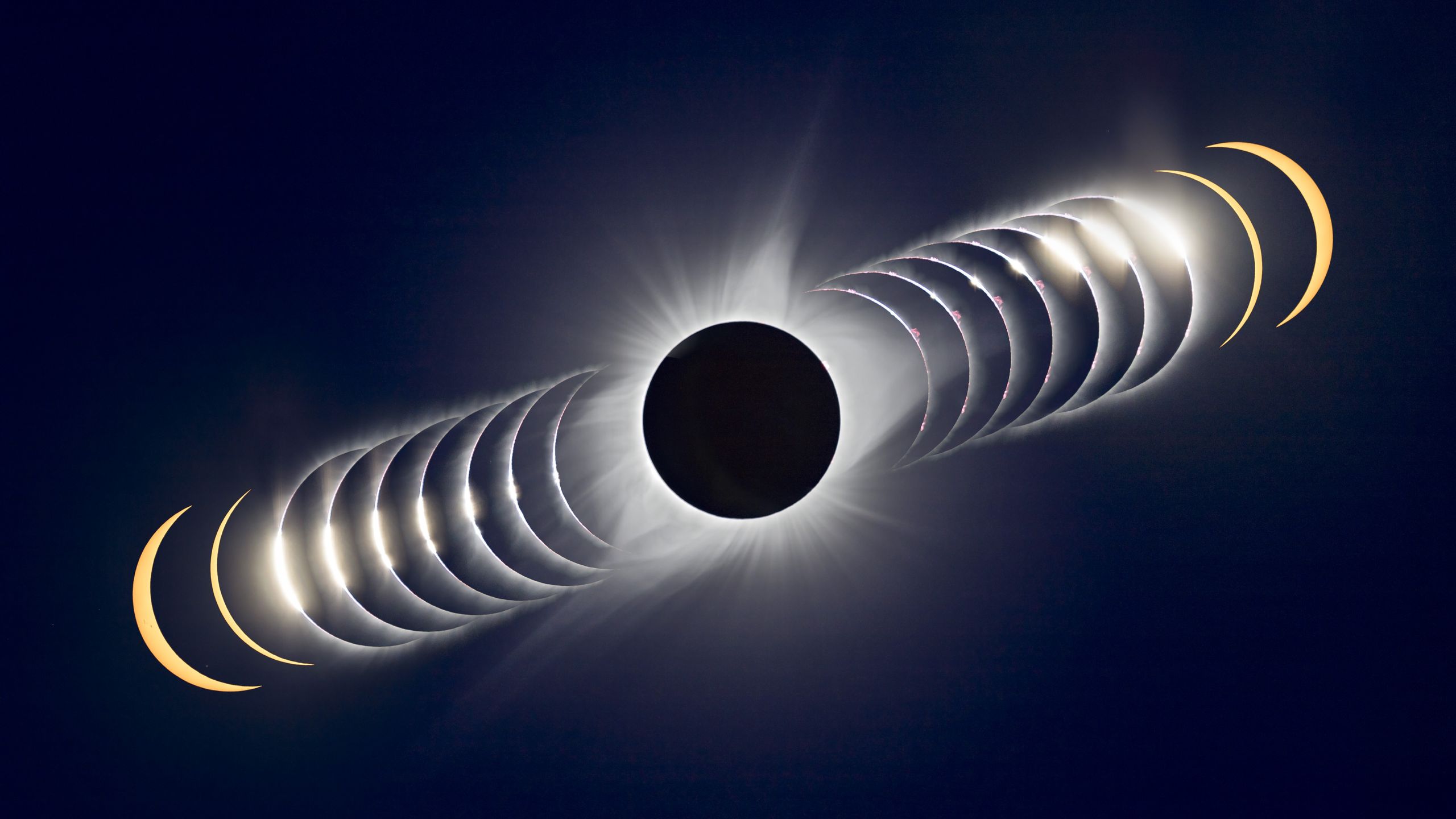 A composite image showing totality as the lunar disk hides the face of the sun. Images are stacked diagonally either side