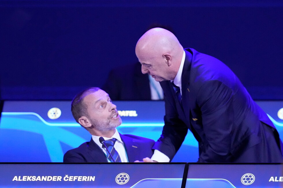 FIFA President Gianni Infantino, right, talks to UEFA President Aleksander Ceferin during the FIFA 75th Congress at the