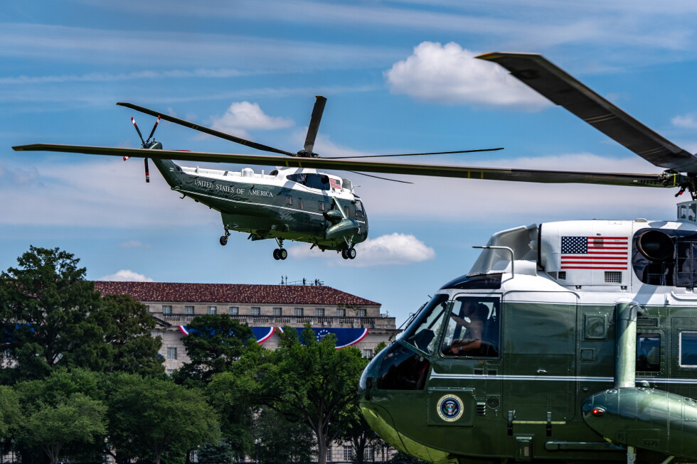 Marine One, left, with President Donald Trump aboard, lifts off from the Ellipse, Tuesday, Aug. 4, 2026, in Washington. (AP