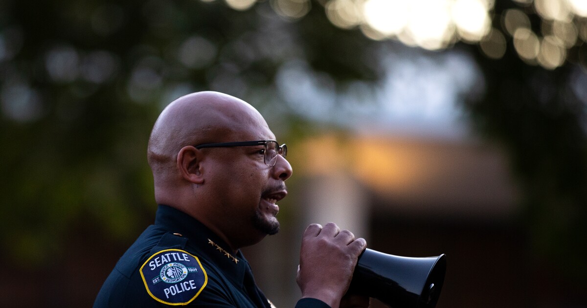 Seattle police chief Shon Barnes speaks to the crowd at a vigil honoring the 3 people who were shot and killed during Bite
