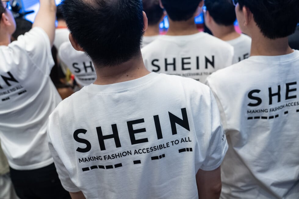 A logo of fast-fashion retailer Shein is seen on the t-shirt at the listing ceremony in Hong Kong, Tuesday, Sept. 1, 2026