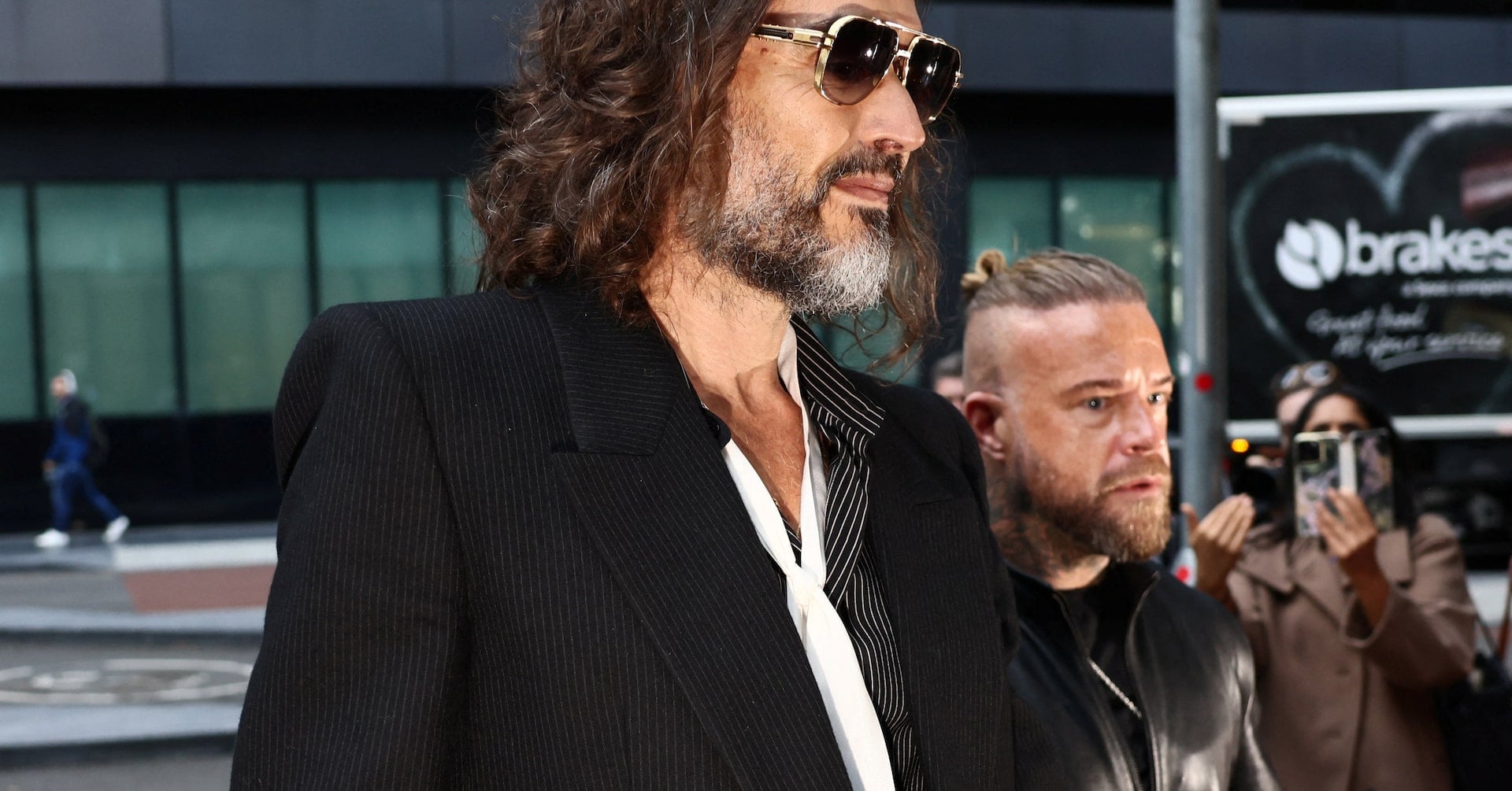 British actor and comedian Russell Brand arrives at Southwark Crown Court where he stands trial on charges of rape and